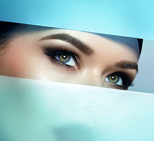 A close-up of a woman's eyes to show eyelash growth after using latisse