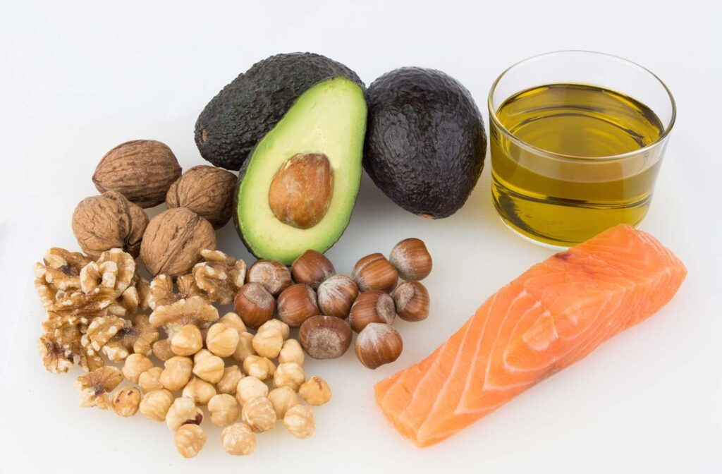 Avocado, nuts, fish oil, and salmon showing healthy things to eat have great nutrition to prevent dry eye