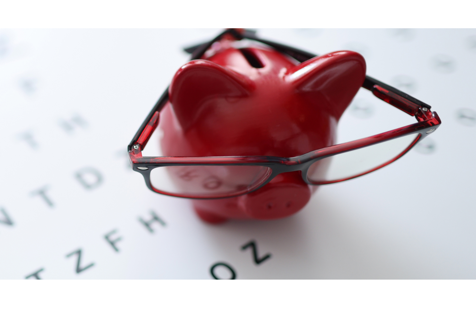 Piggy bank with glasses on top to portray eye insurance and if insurance covers LipiFlow