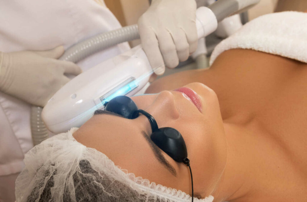 A woman getting an optometrist to treat her dry eye using Intense pulsed light (IPL) treatment.