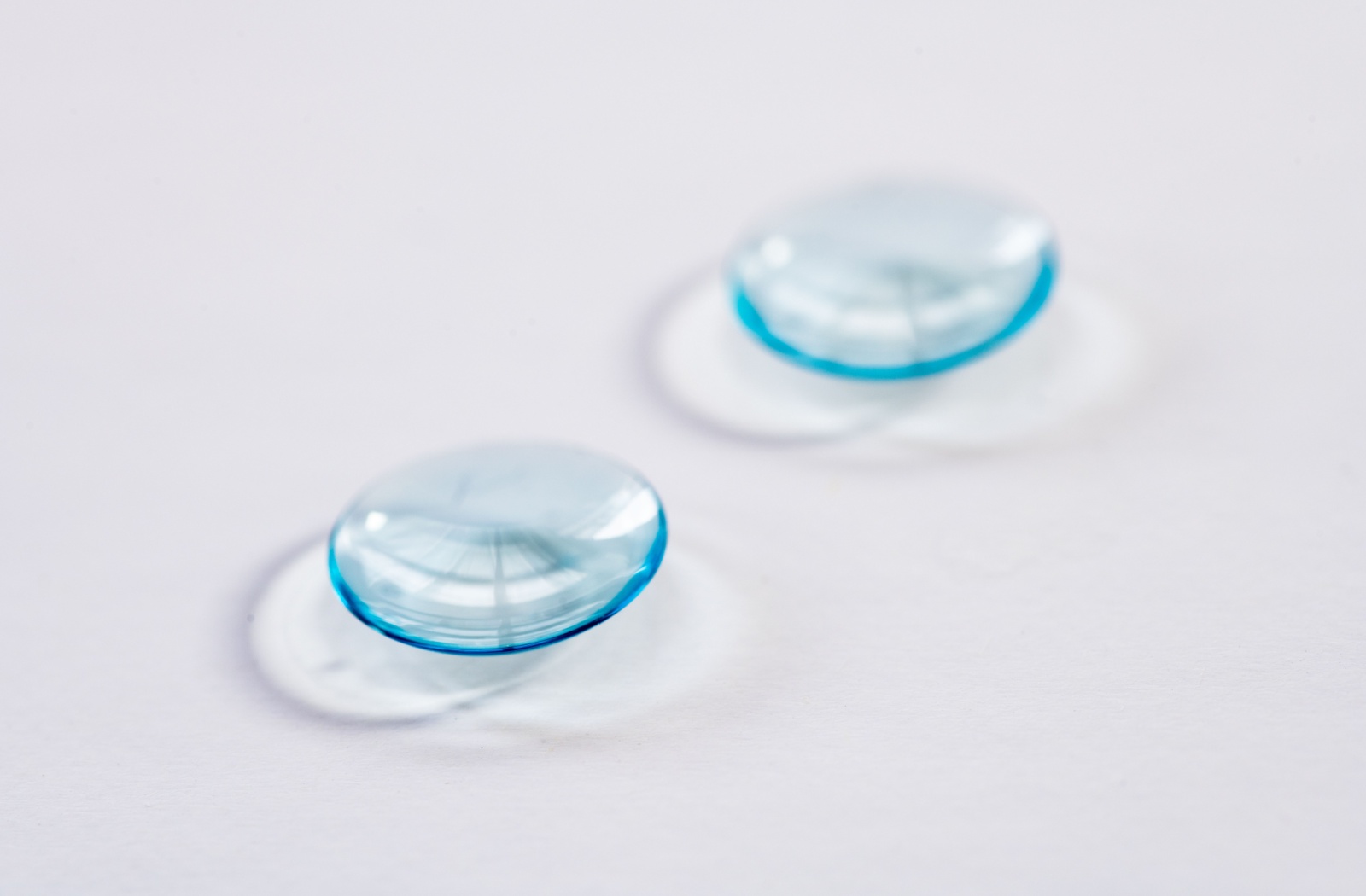 Close-up of multifocal contact lenses placed on a clean surface.