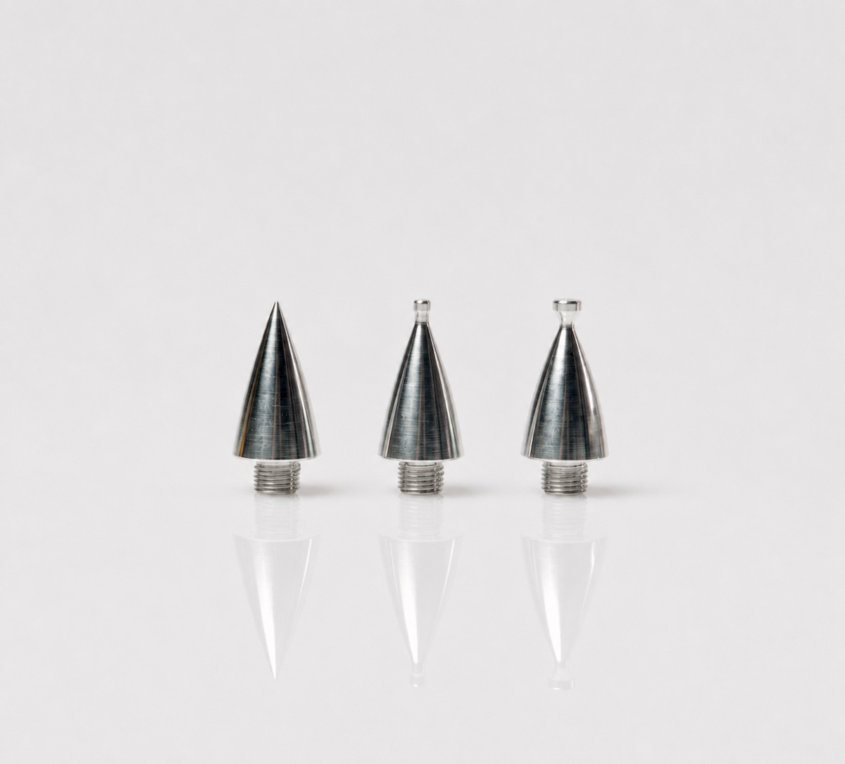 Three silver microcurrent tips used with the Jett Plasma Pen for eyelid treatment.